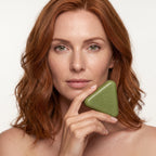 Model holding the scalp revival bar